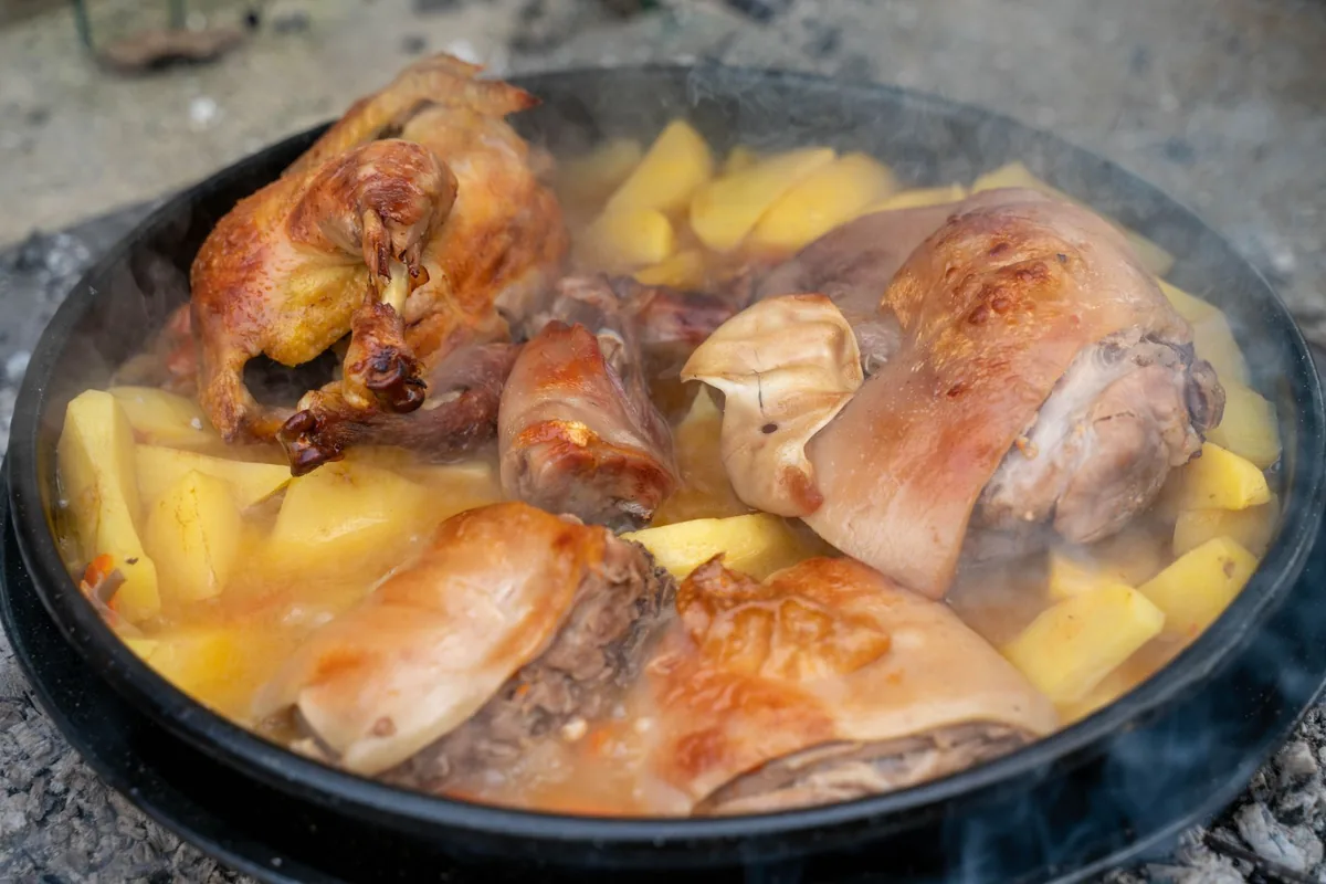A braise simmering in a heavy pot