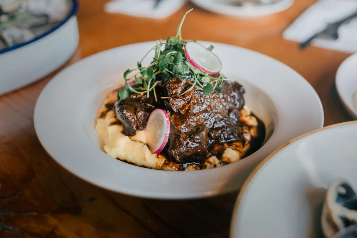 A braised beef dish served