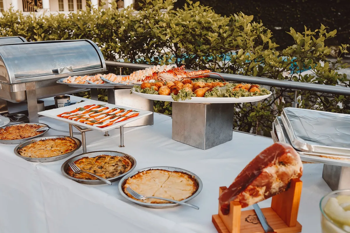 A buffet table being set