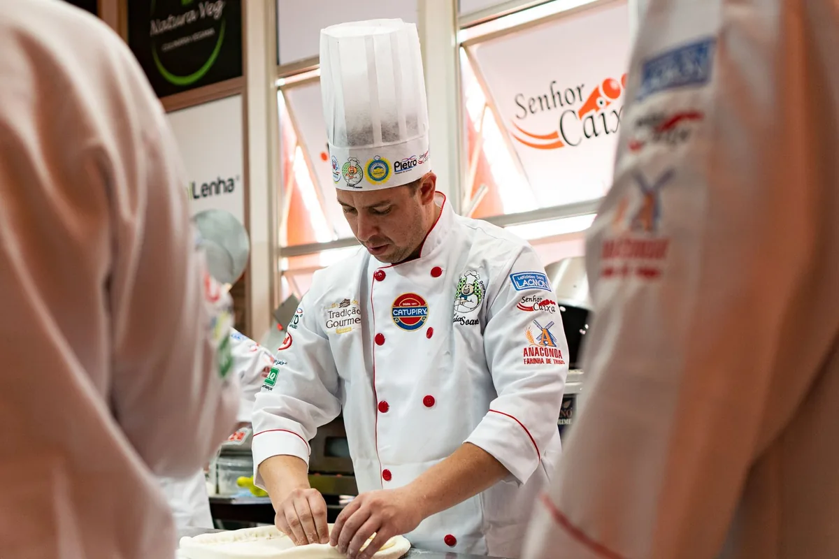A chef preparing pizza dough