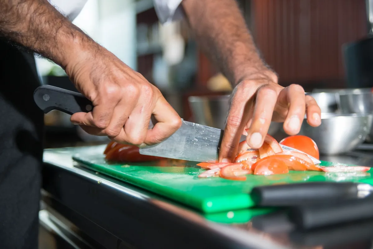 A chef's knife on a board