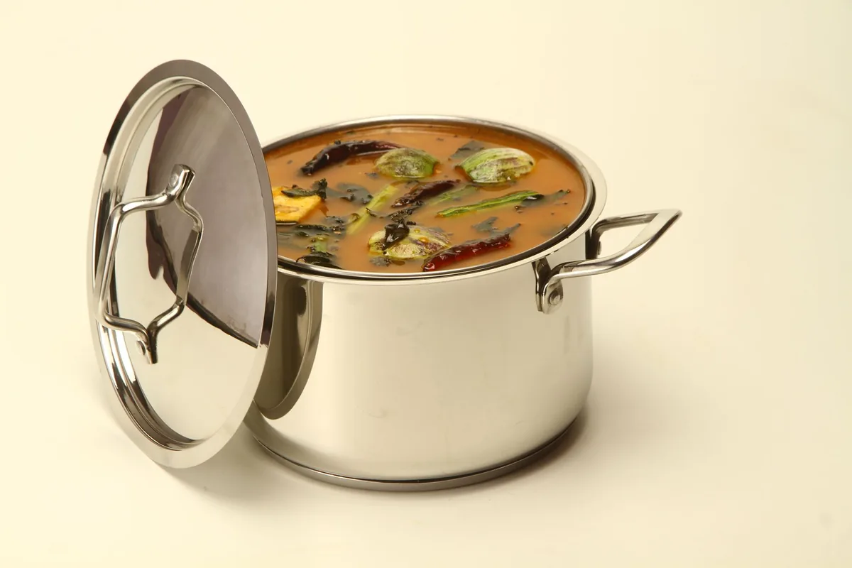 A curry simmering in a metal pot