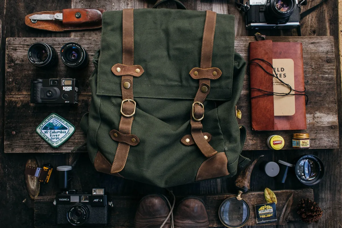 A daypack and gear laid out
