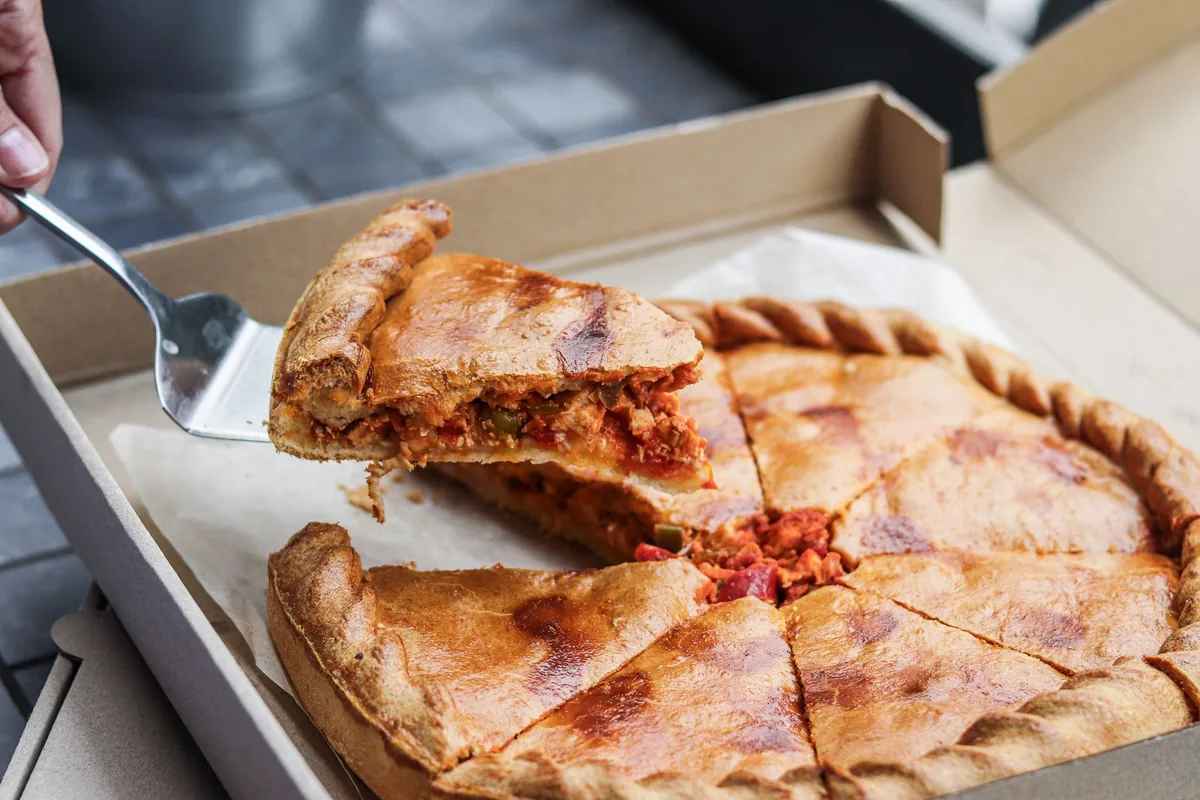 A deep dish pizza slice