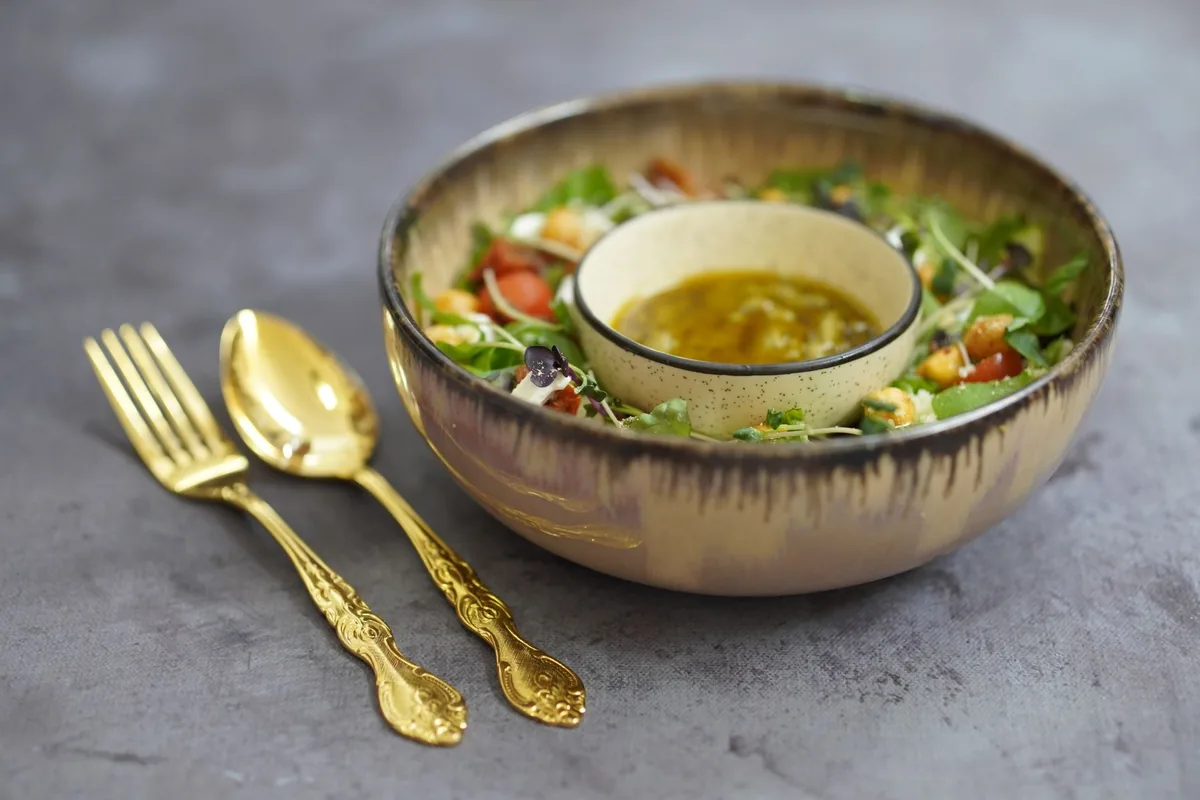A dressed green salad