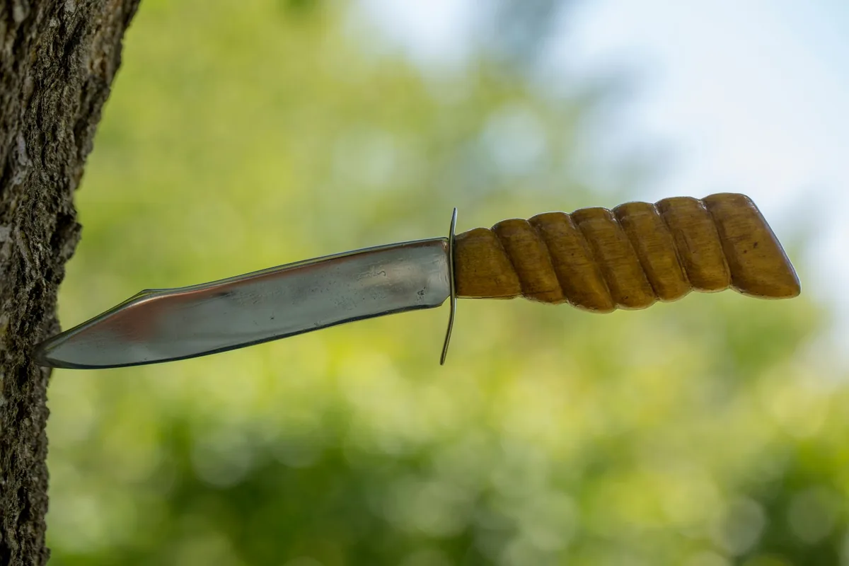 A hunting knife on wood