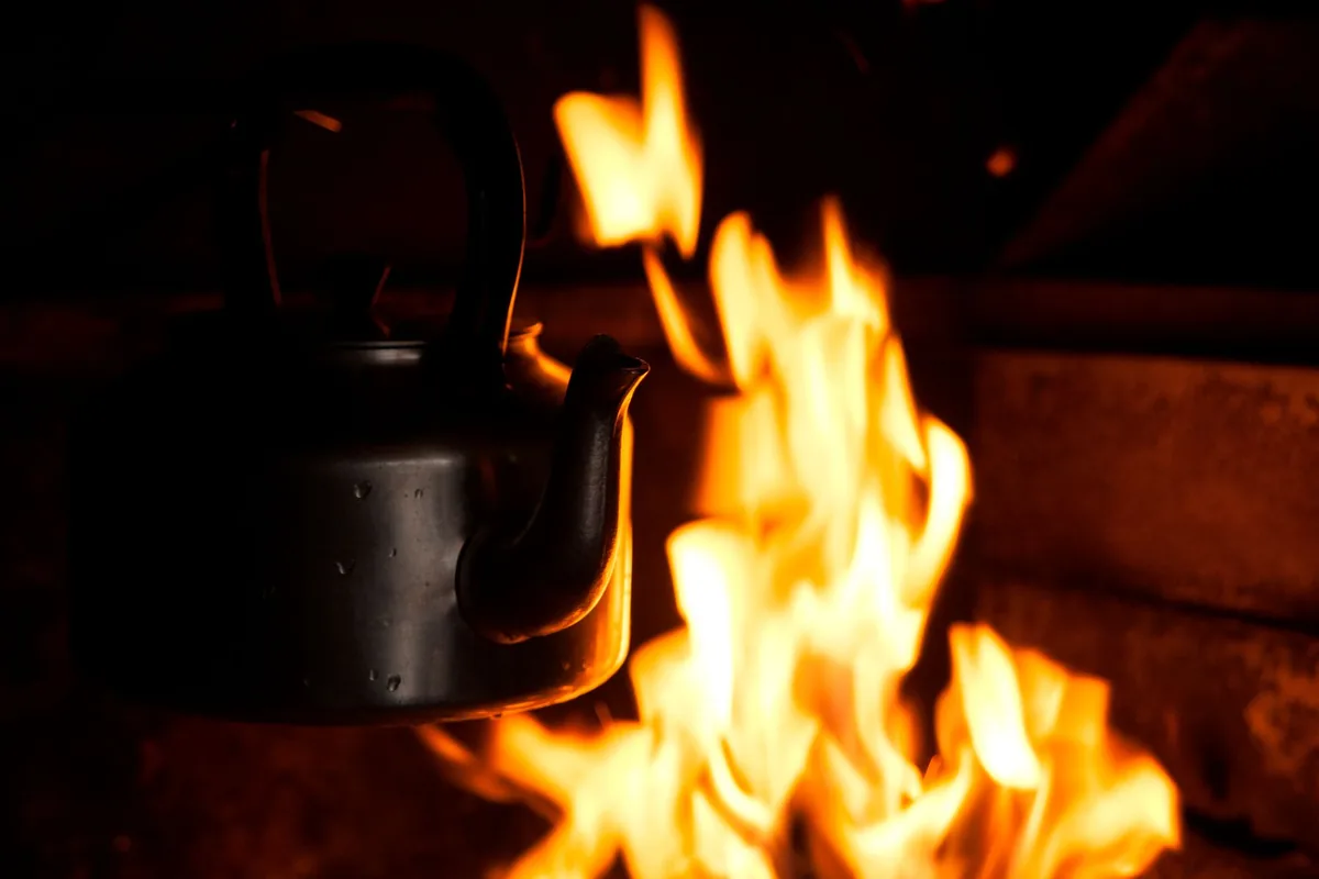 A gooseneck kettle pouring