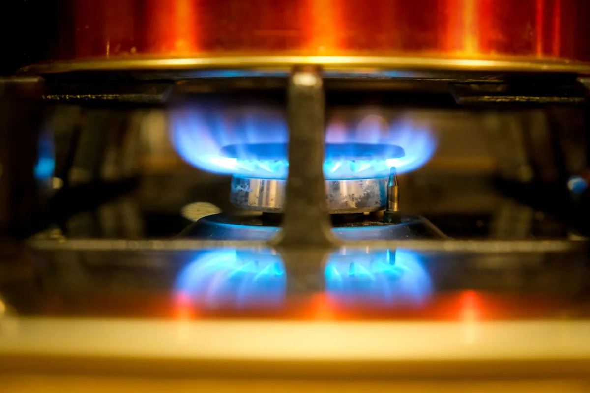 A gas hob burner lit