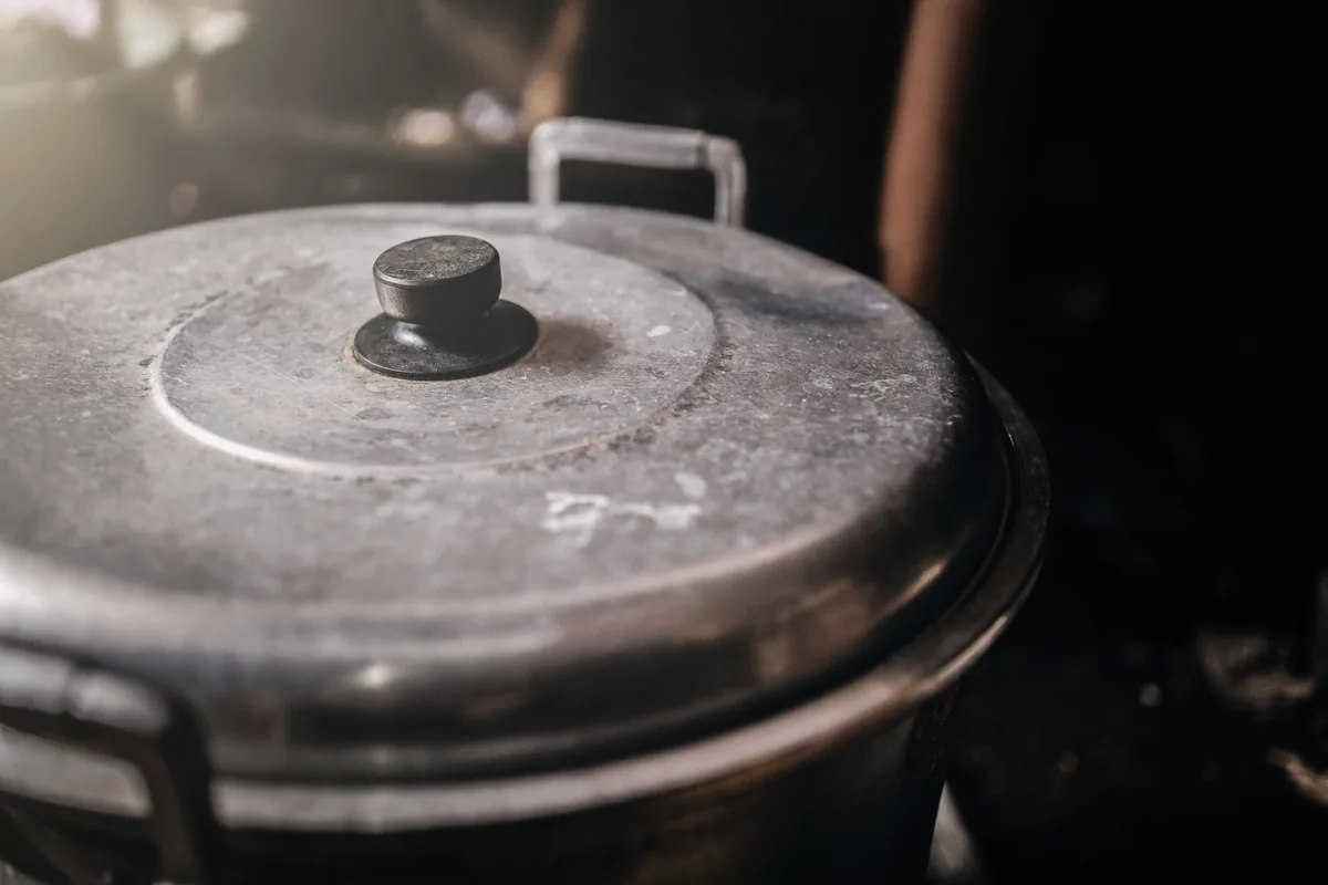 A lid lifted in steam