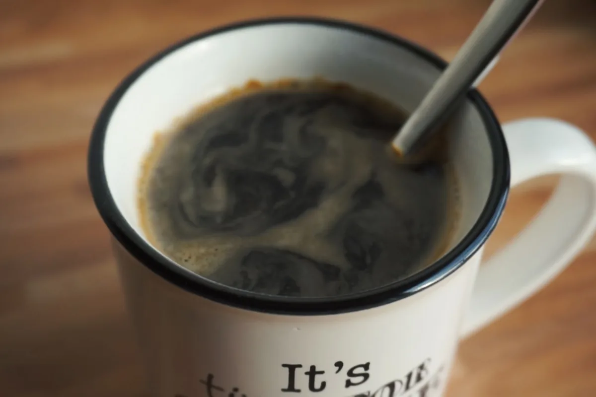A mug of black coffee on a table