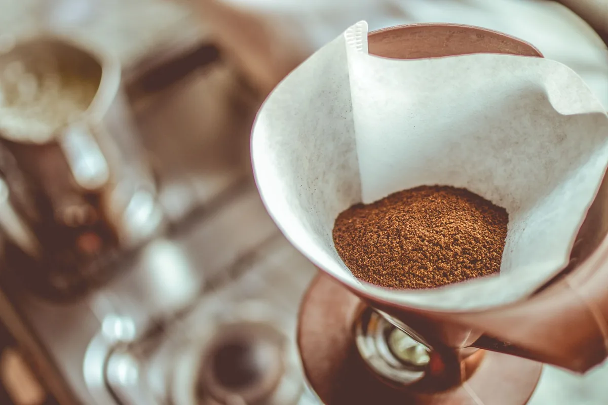 A paper filter cone of coffee