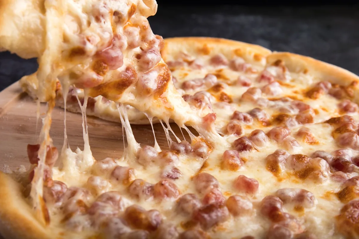 A pizza with melted cheese
