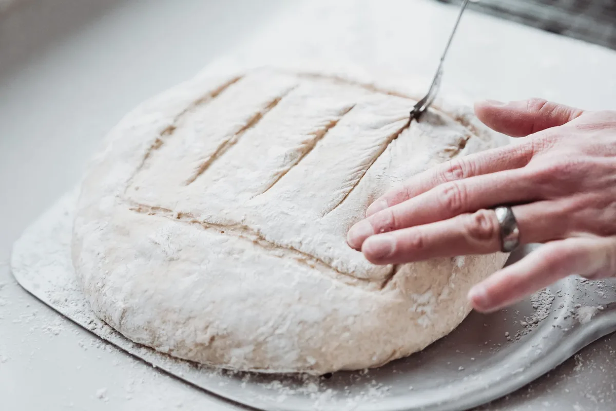 A scored sourdough loaf