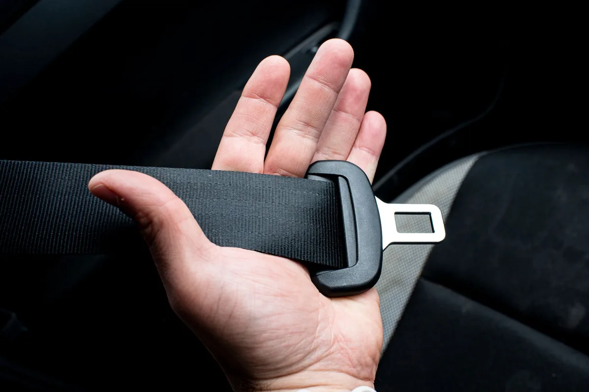 A seatbelt being released