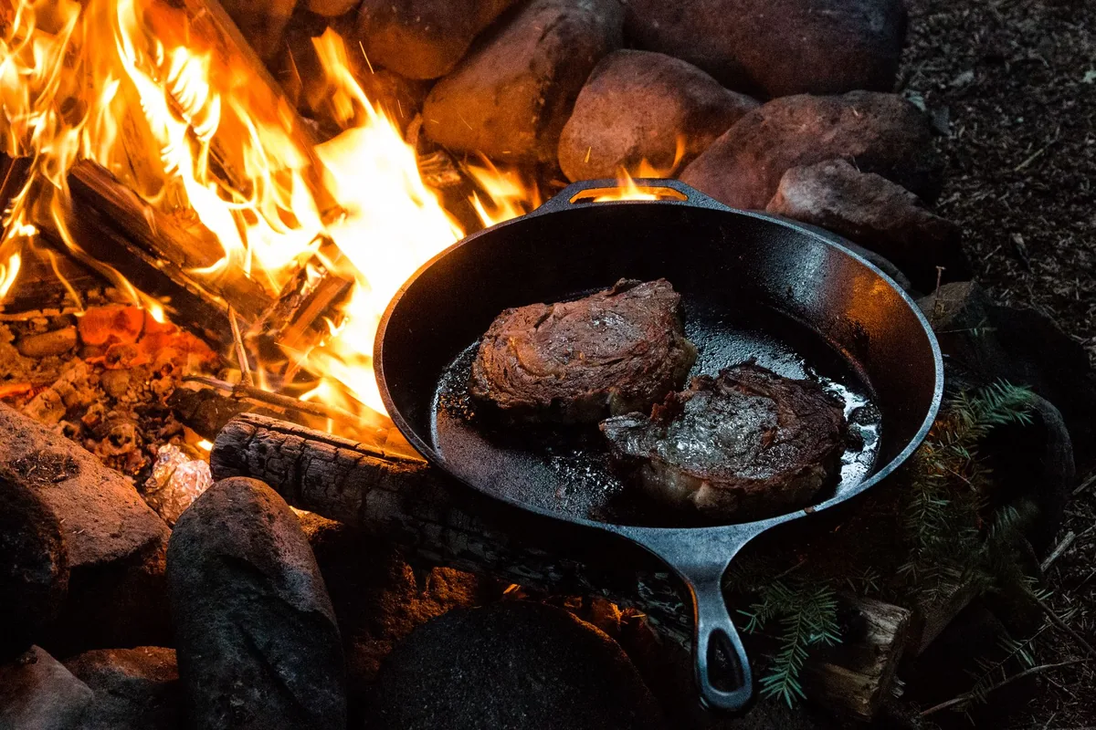 A steak searing in a pan