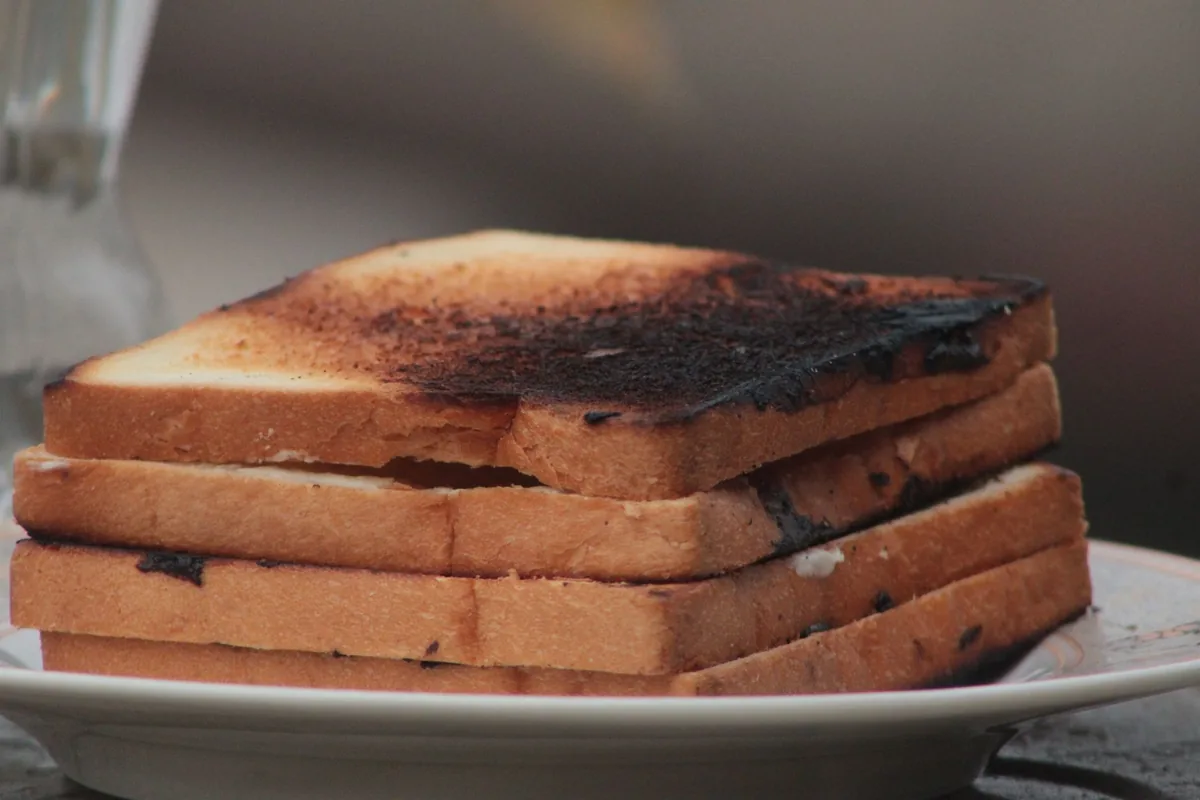 A thick-cut slice being toasted