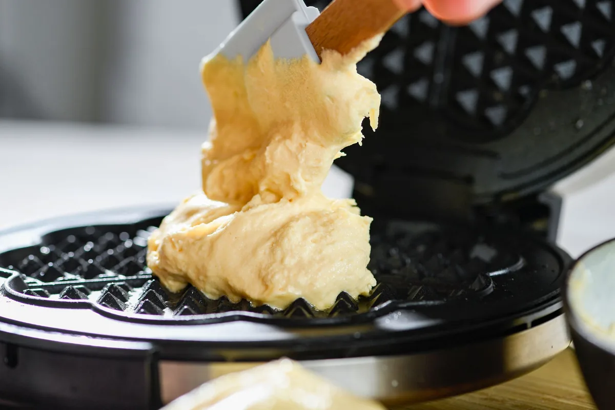 Batter poured onto a hot waffle iron