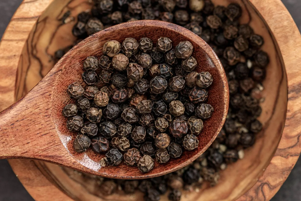 Black peppercorns in a bowl