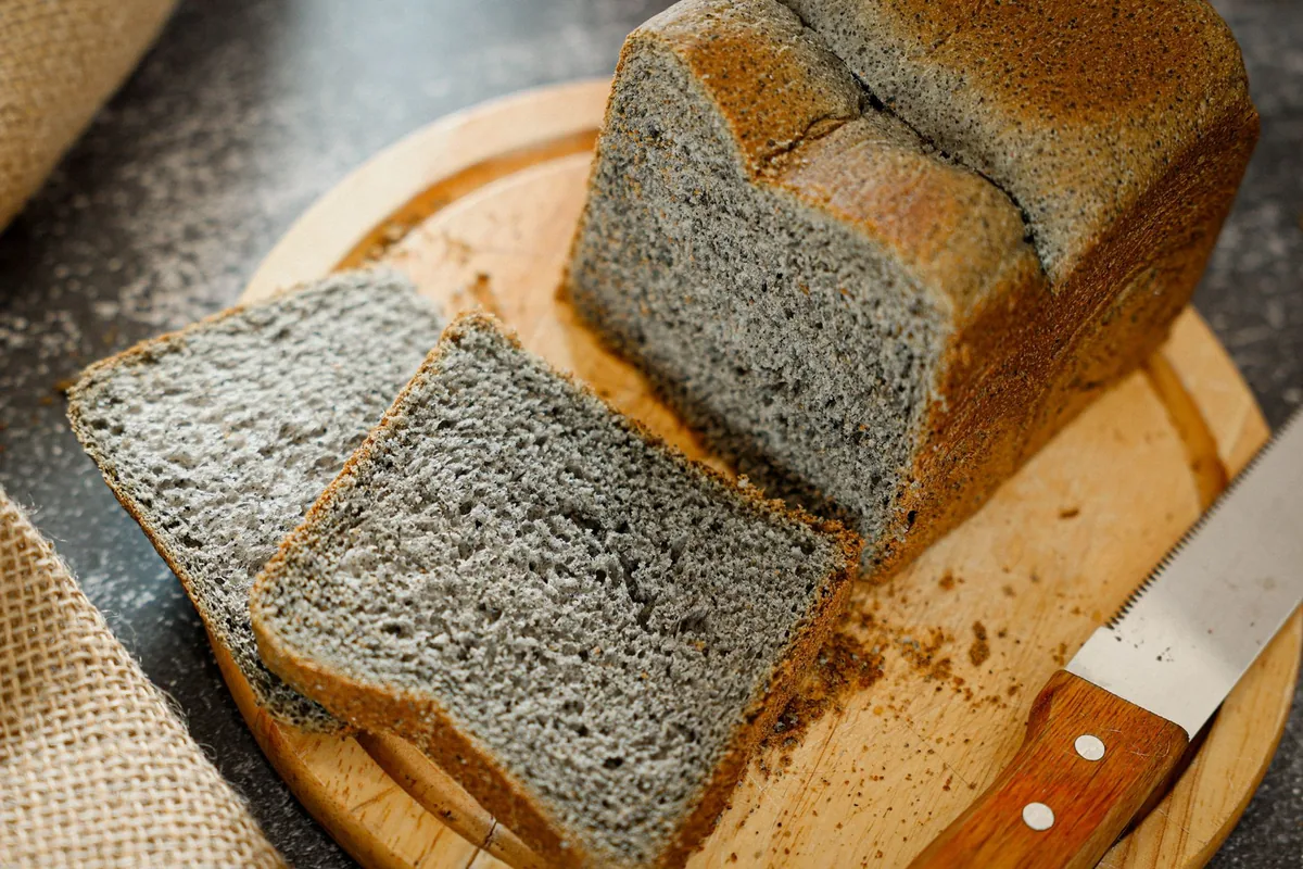 A black sesame bread loaf and slices