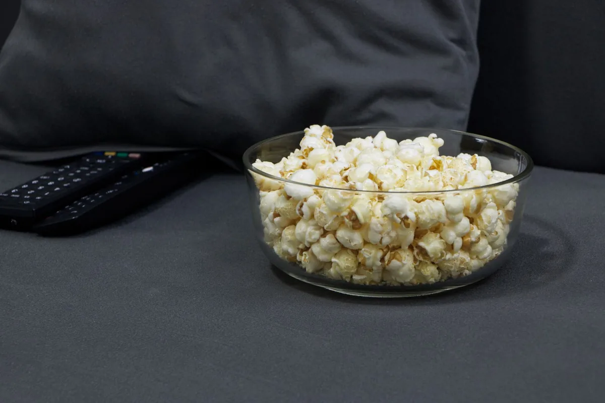 A glass bowl filled with popcorn