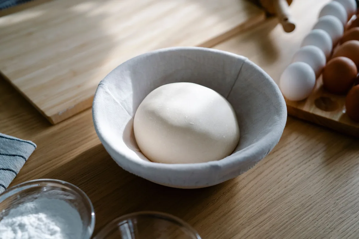 Bread dough rising in a bowl