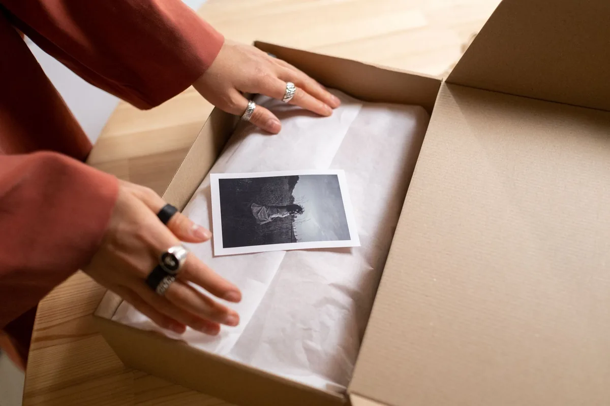 Cardboard being cut open