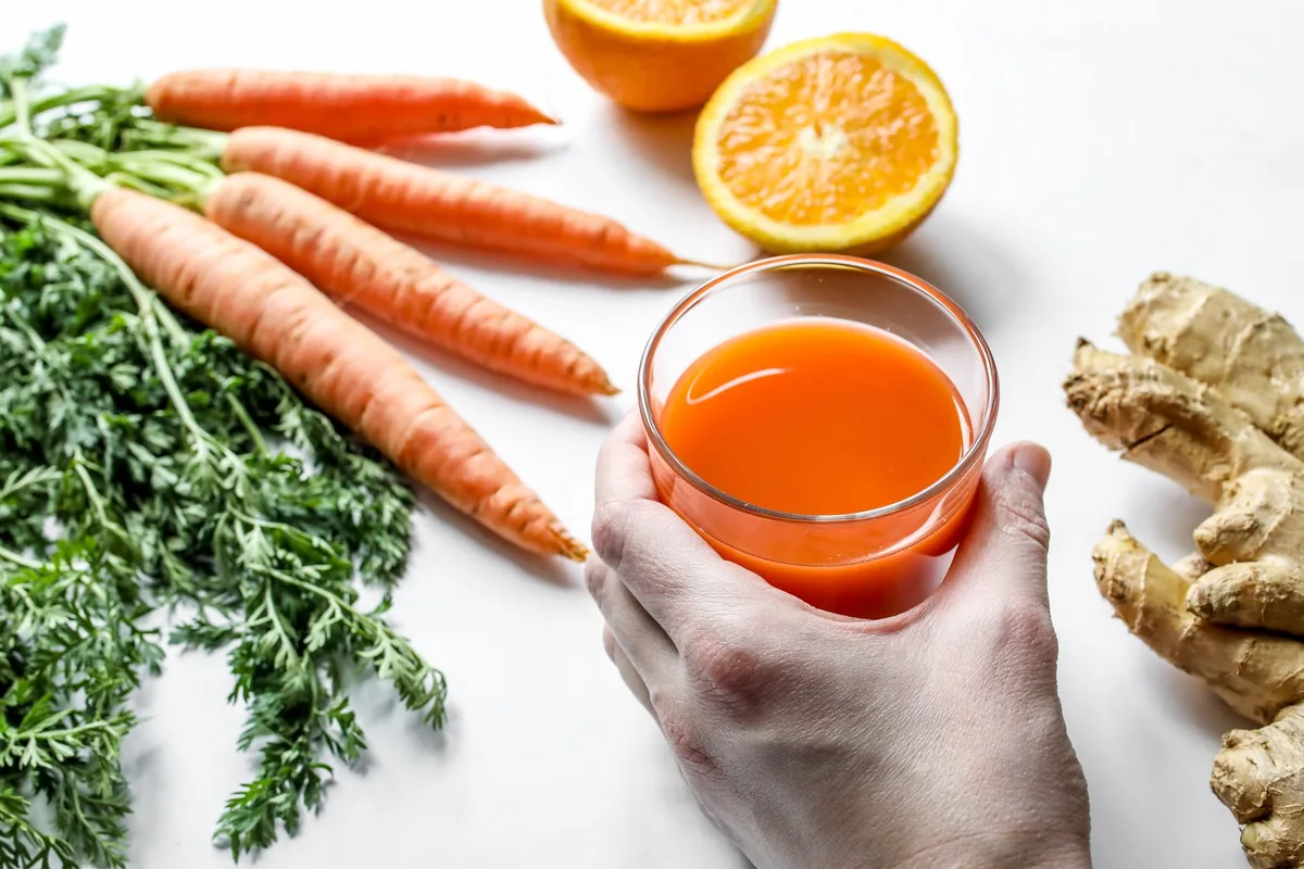 Carrot, ginger and orange juice with ingredients