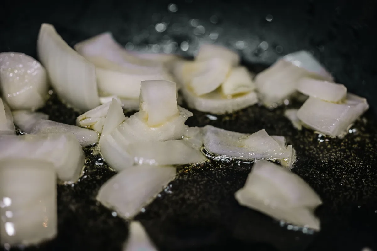 Chopped onions sizzling in oil