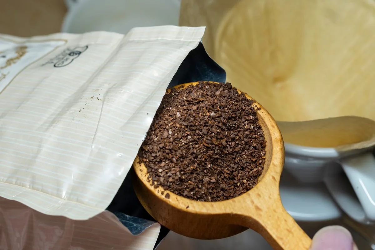 Coarse ground coffee in a scoop