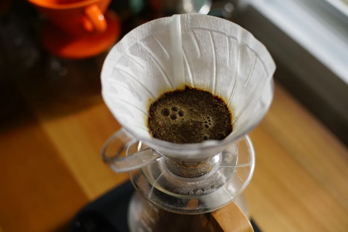 Coffee dripping through a paper filter