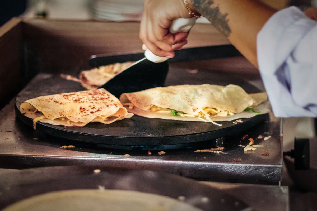 Cooking crepes on a hot plate