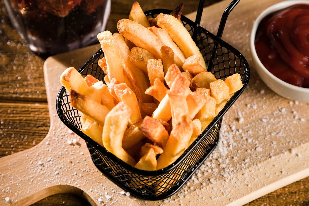 Crispy homemade french fries with ketchup