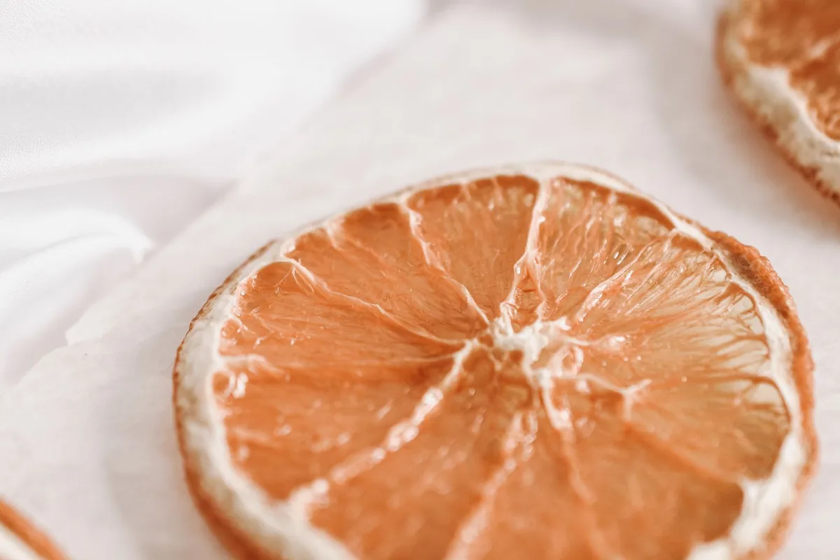 Dried orange slices on a wooden board
