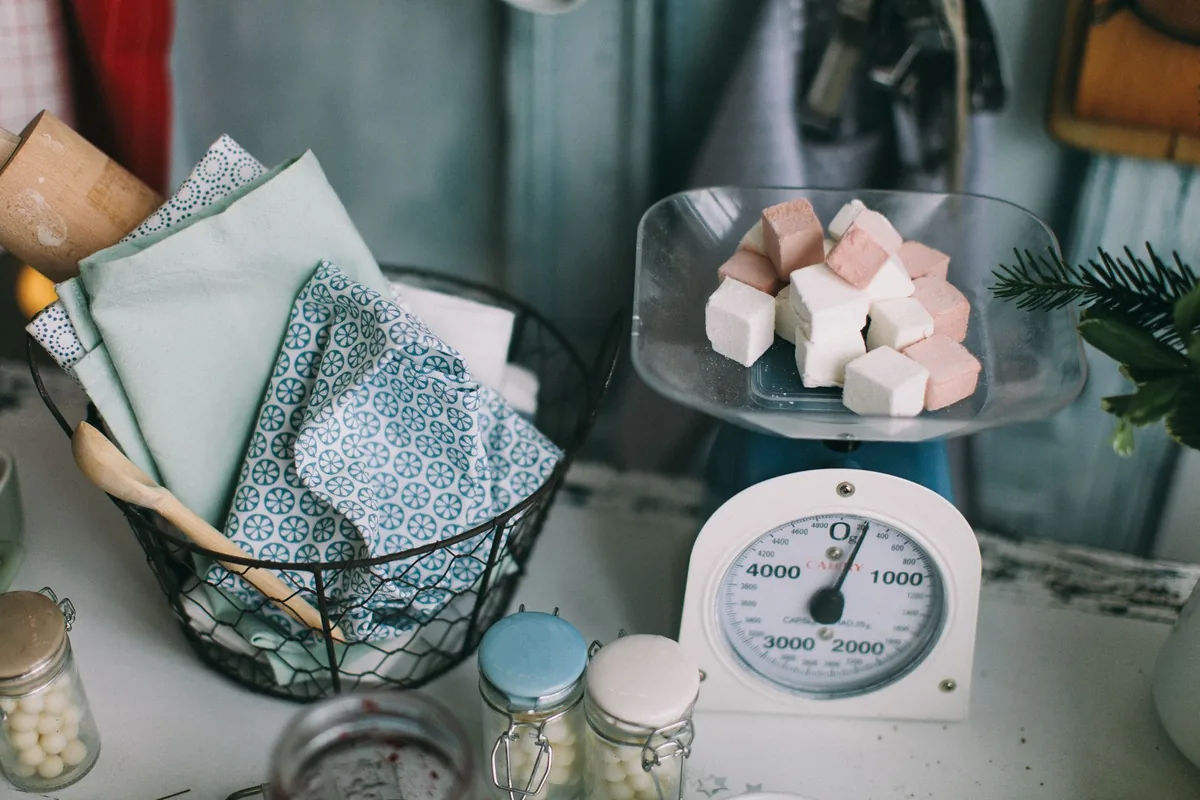 Flour being weighed on a scale