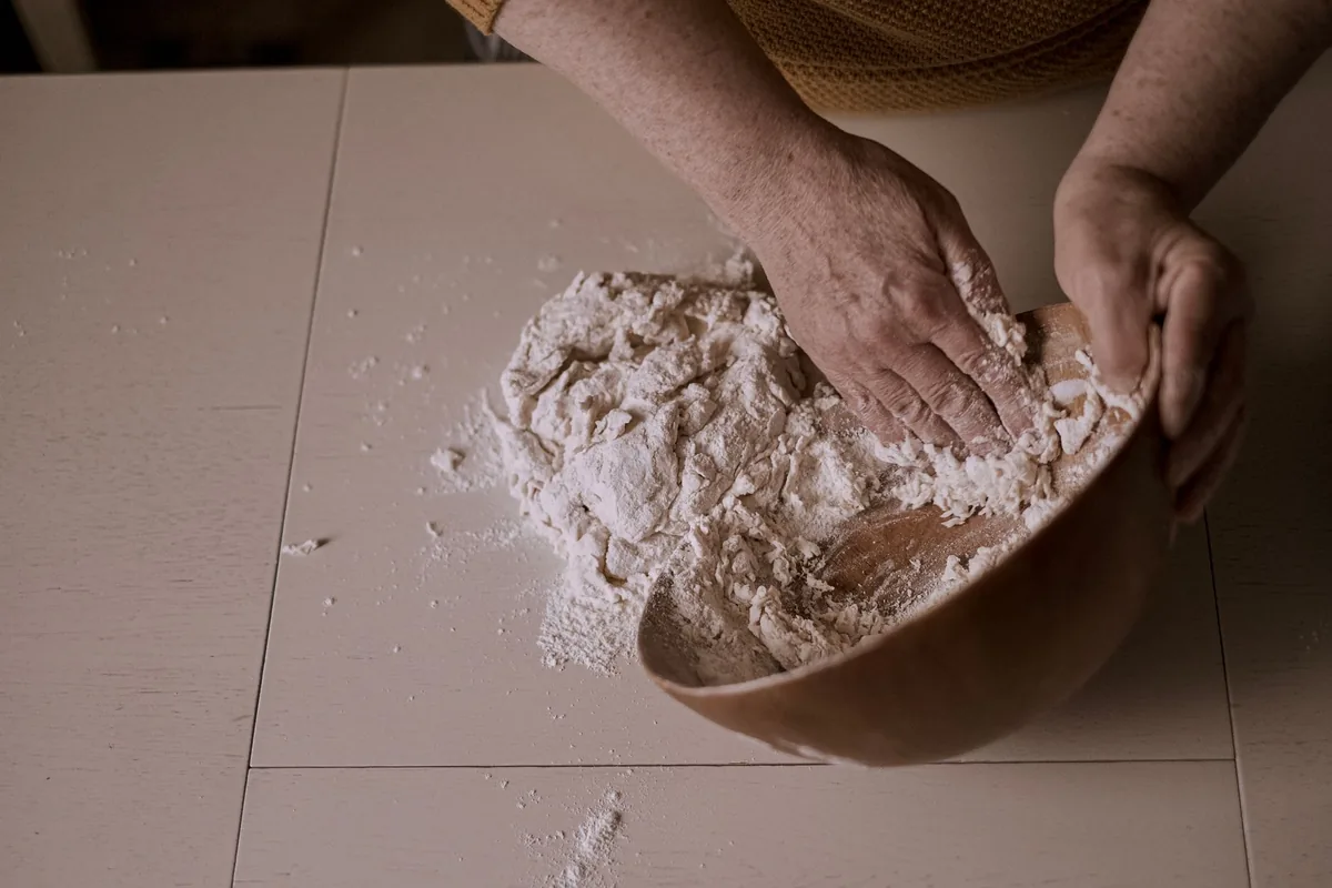 Folding flour into a mixture
