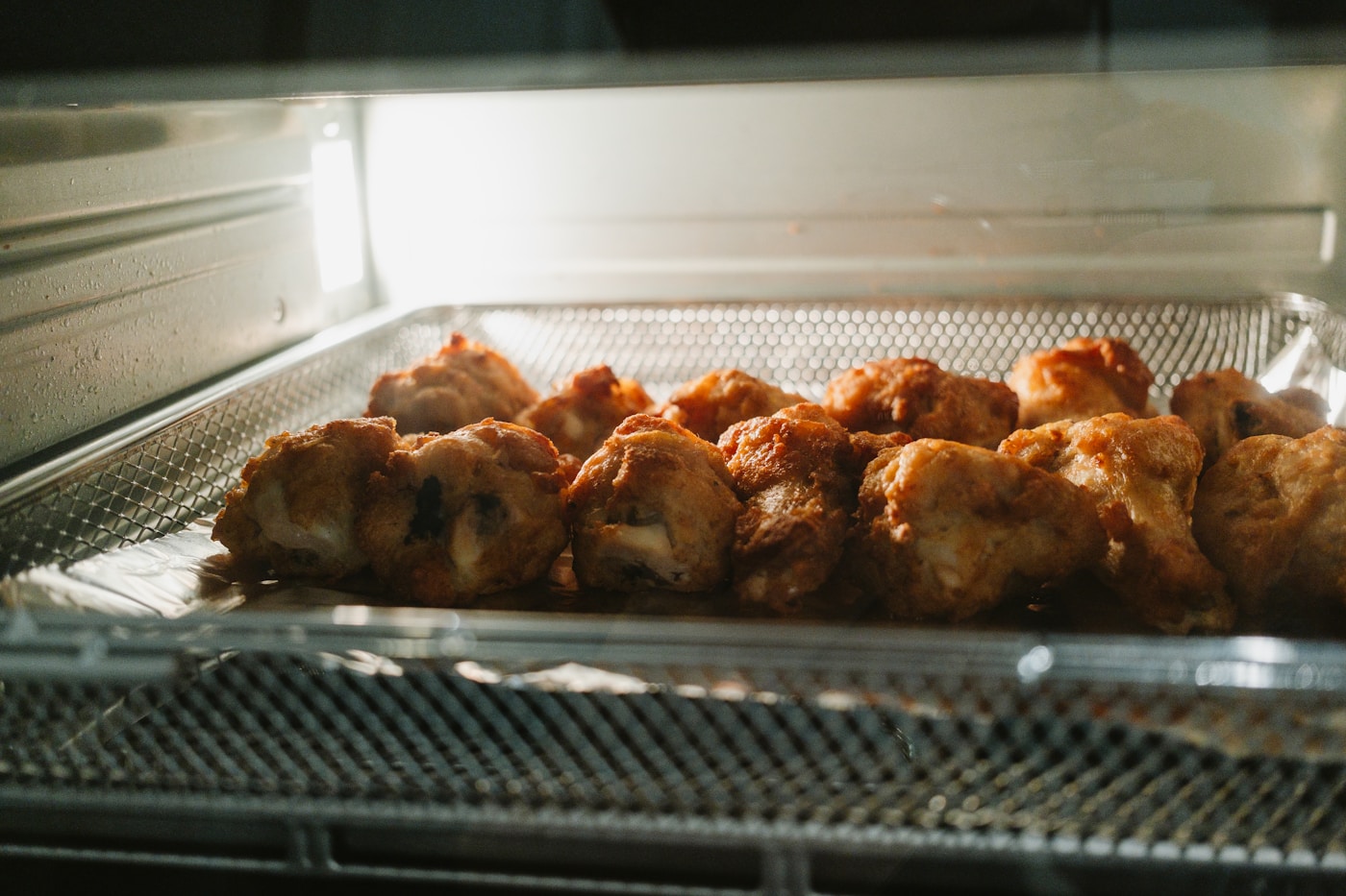 Food crisping up inside an air fryer basket