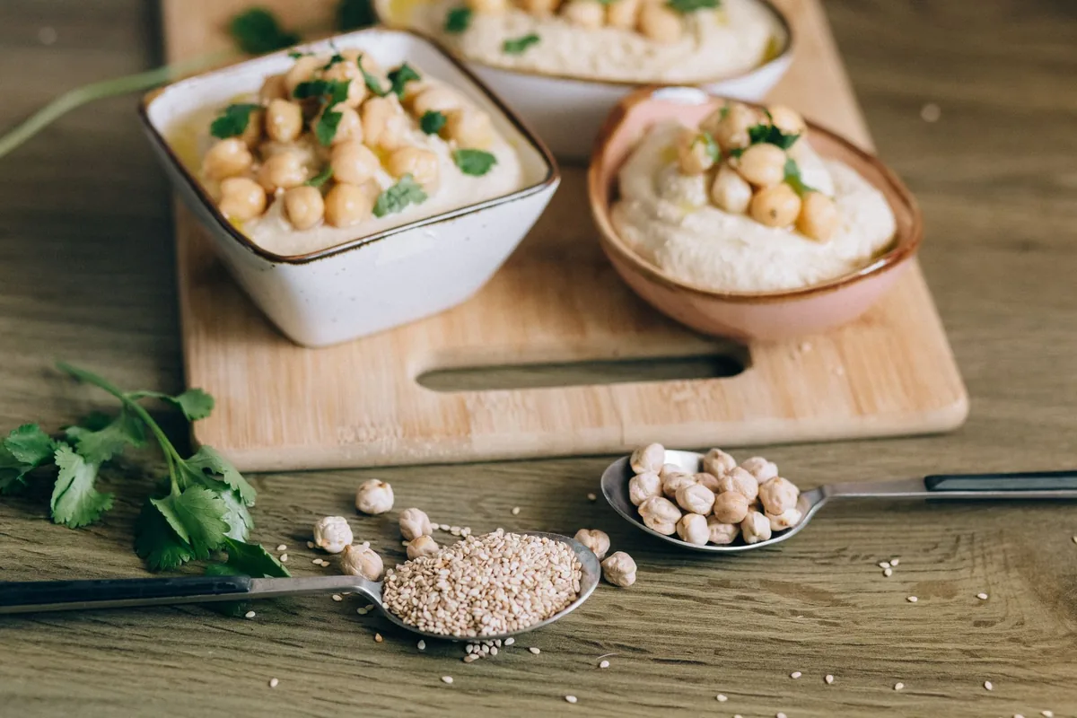 Creamy hummus garnished with chickpeas and sesame