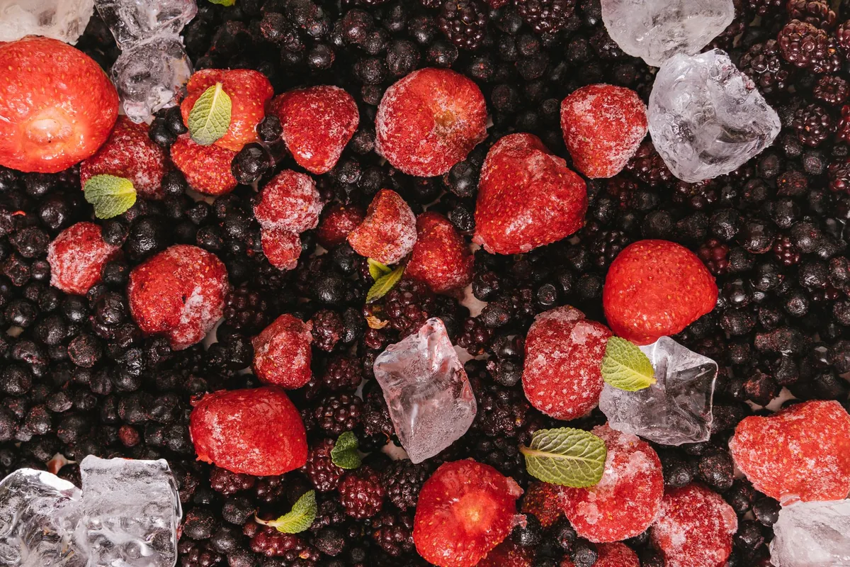 Frozen berries with mint on a tray