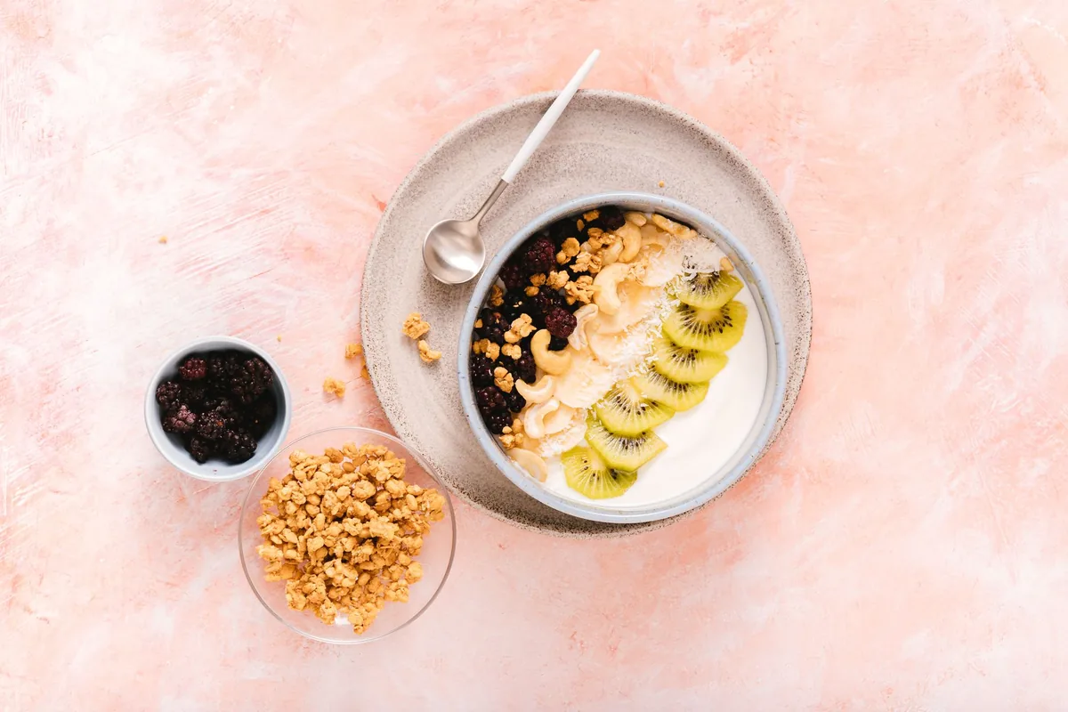 Yogurt bowl topped with kiwi and cashews