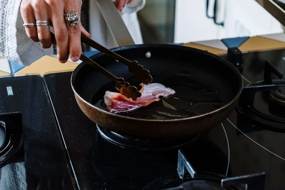 Frying bacon in a skillet