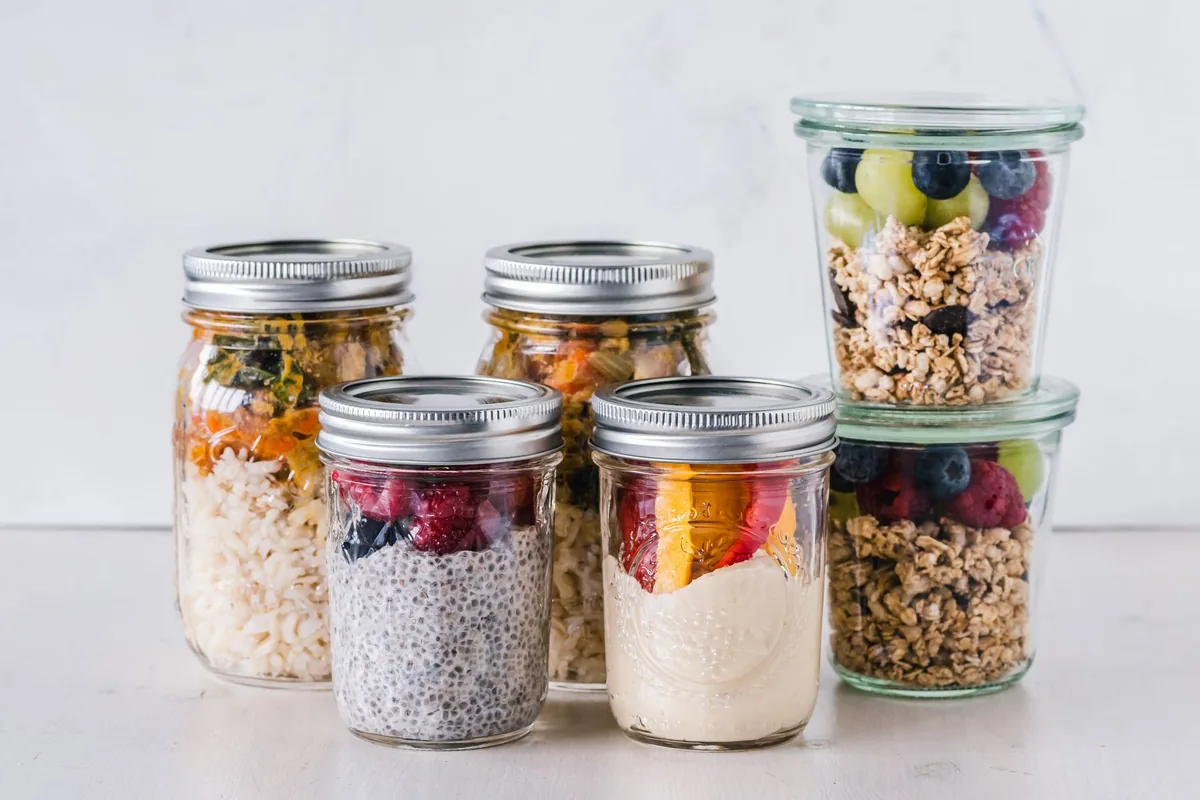 Glass jars of yogurt in a row