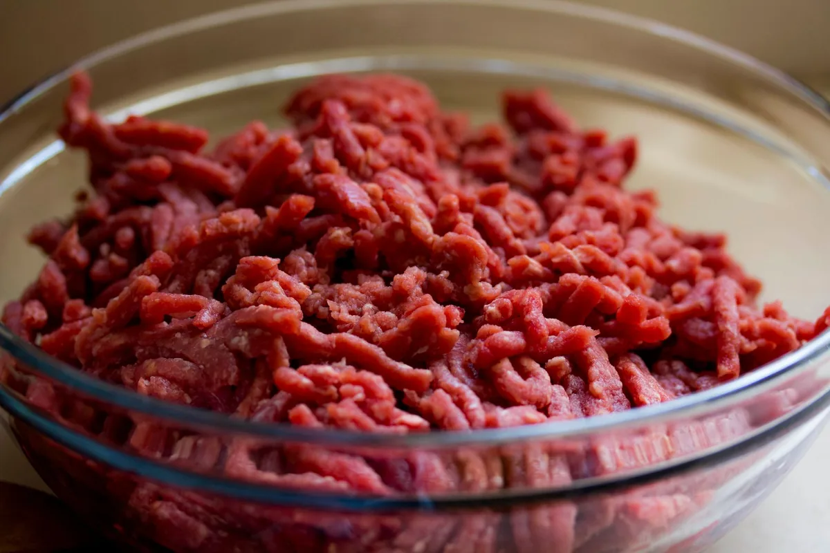 Fresh ground meat in a glass bowl