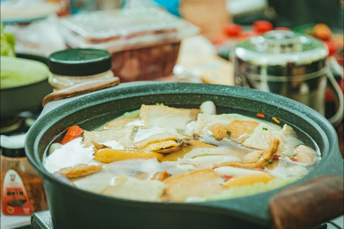 Vegetable soup simmering in a pot, the type of job an immersion blender purées without transferring