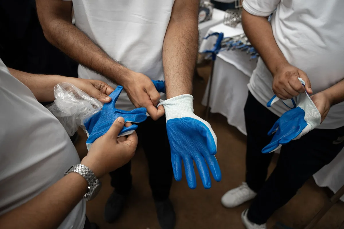 Gloved hands working
