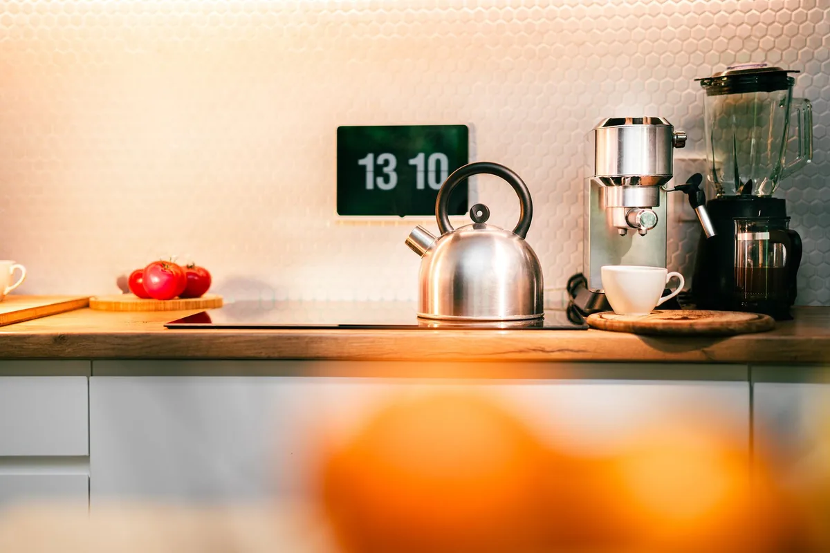 Contemporary kitchen counter with a kettle and coffee machine
