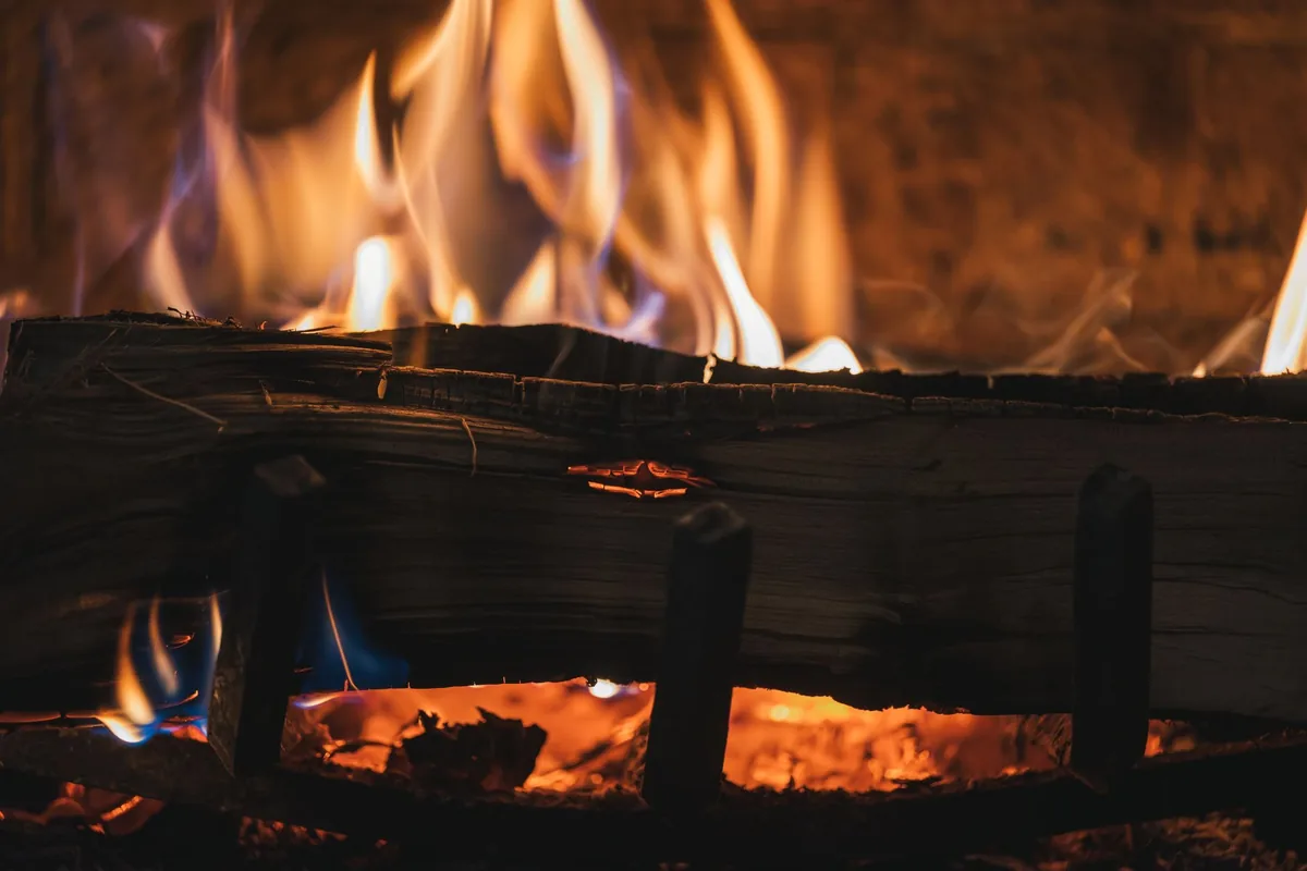 Logs beside an oven