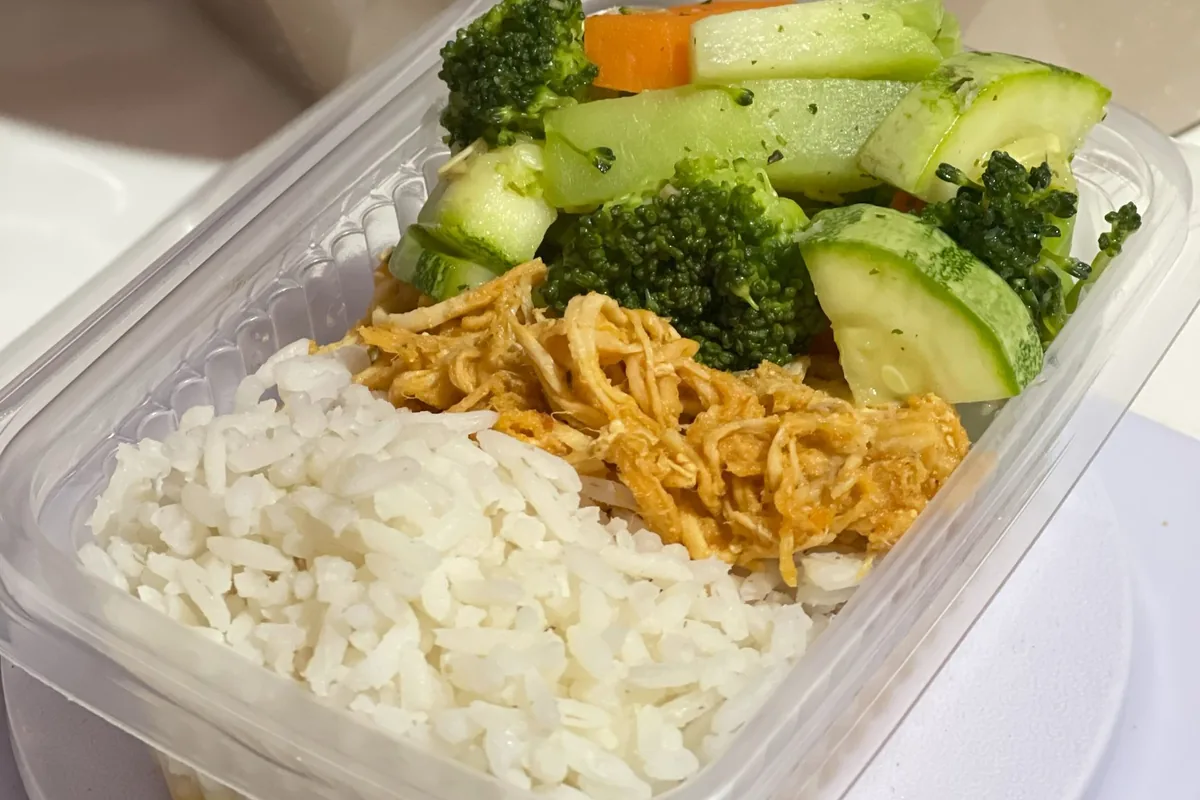 Meal prep box with rice, shredded chicken and mixed vegetables