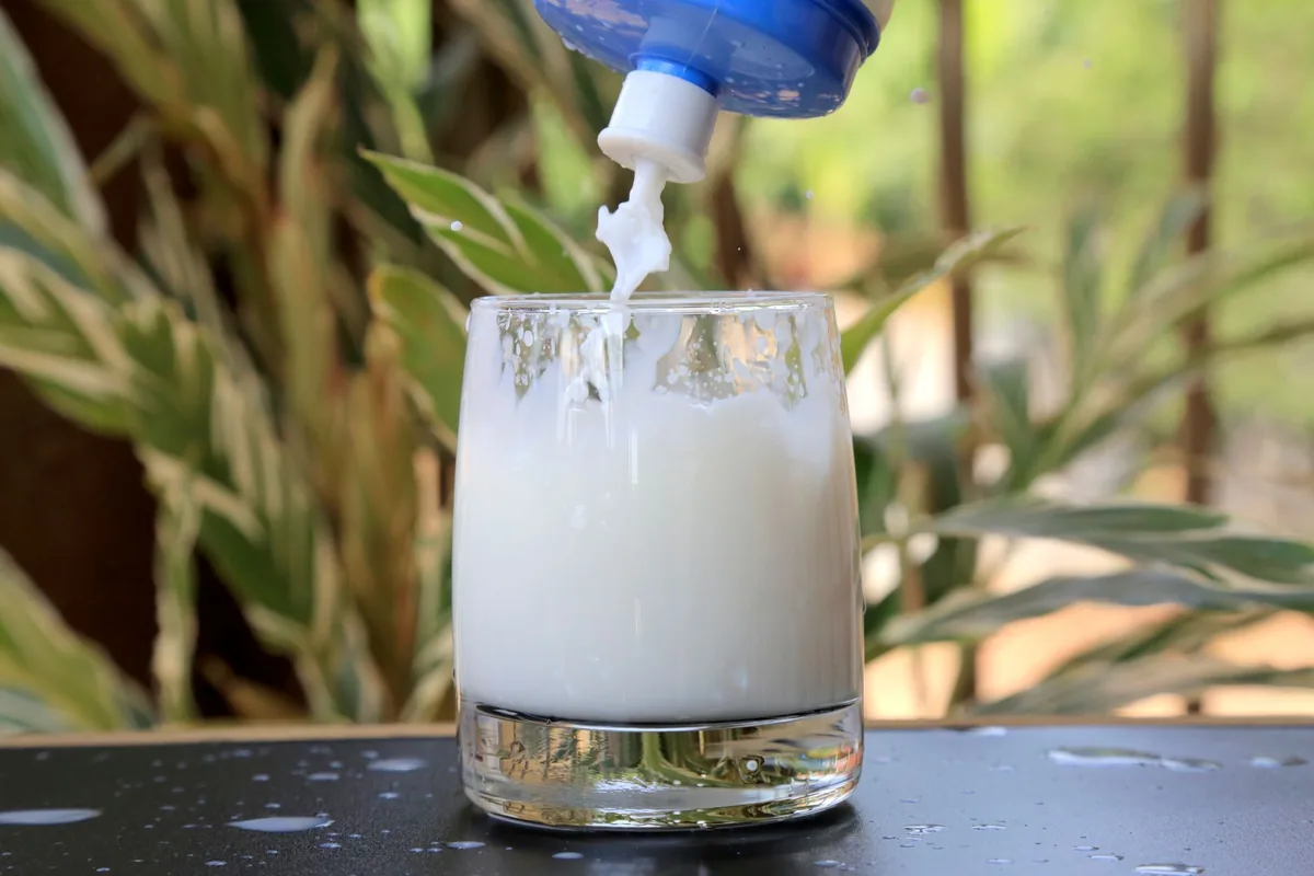 Milk being poured into a glass