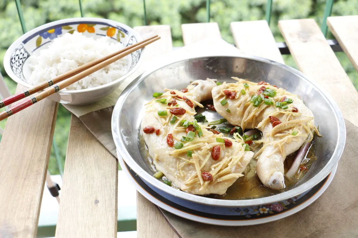 Asian-style chicken served with a bowl of steamed rice