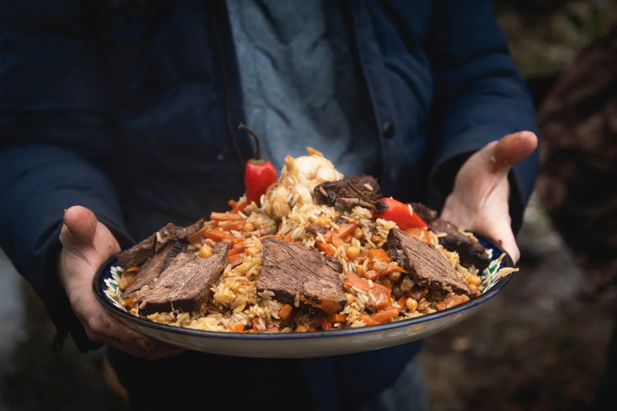 Plate of beef pilaf with vegetables
